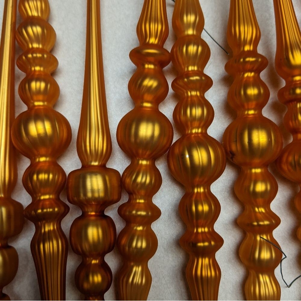 Ornaments! (12) gold colored plastic lightweight ornaments, 10" length each